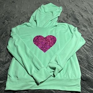 Size small relaxed-fit mint green Melanie Jacqueline heart sweater.